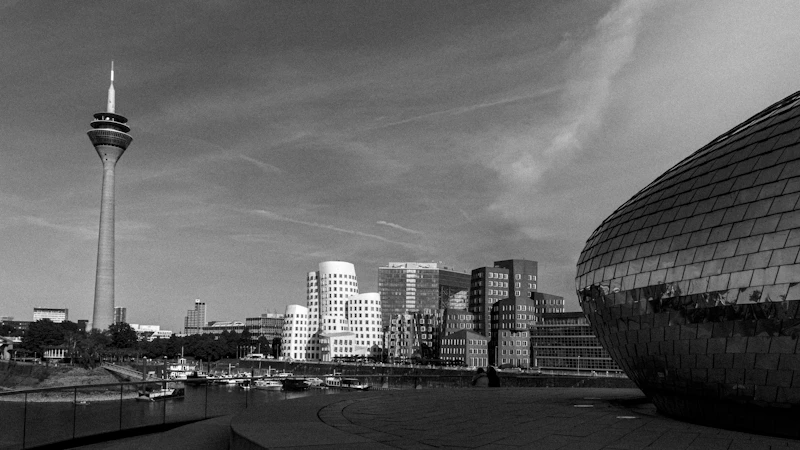 A cityscape featuring a tall tower.