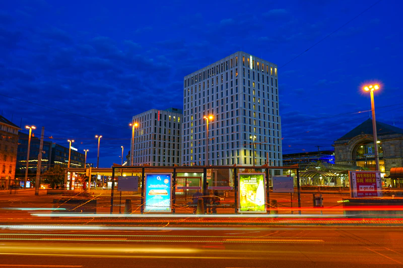 City buildings at night with light trails